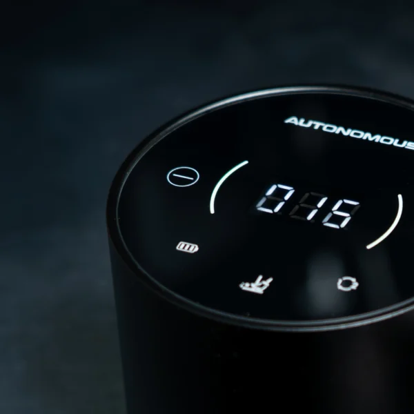Autonomous Tamper touchscreen showing pressure settings next to espresso portafilter